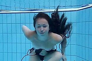 /images/Cute Umora is swimming nude in the pool